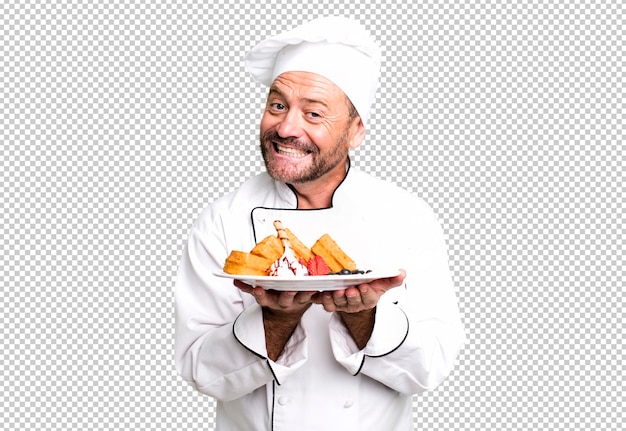 PSD concepto de chef de hombre de mediana edad y concepto de entrenador deportivo de waffles con una pelota de fútbol