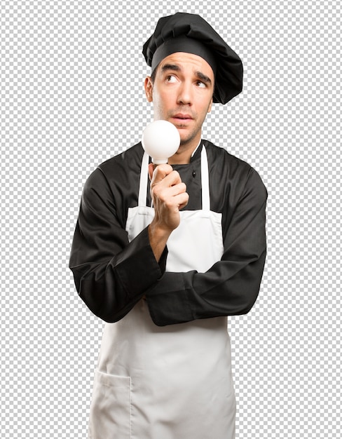 PSD concepto de chef joven teniendo una idea