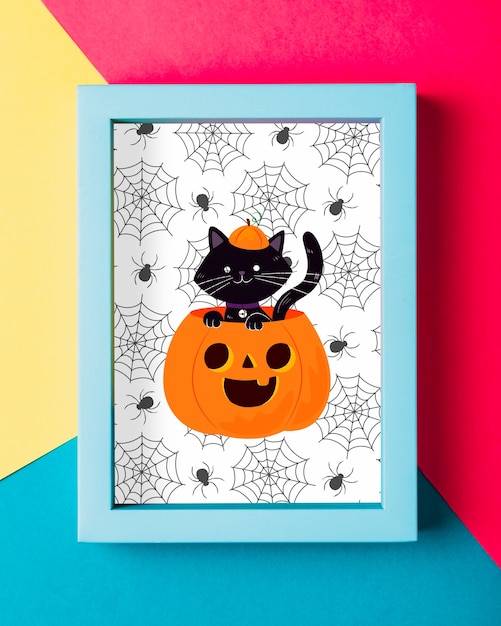 Concetto di cornice di Halloween con gatto nero e zucca