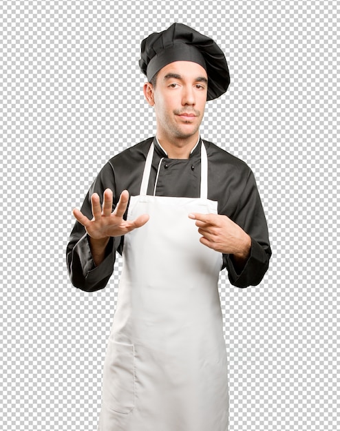 Confiado chef con un gesto de mantener la calma