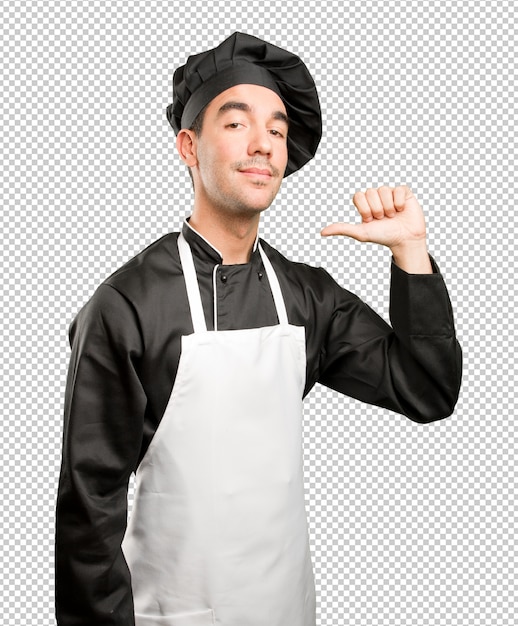Confiado joven chef posando