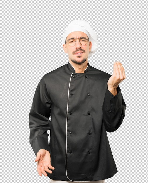 Confuso jovem chef fazendo um gesto italiano de não entender