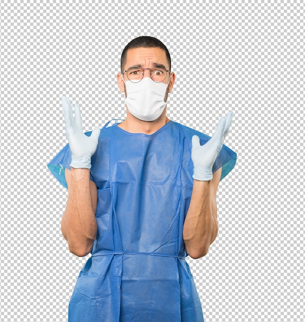 Coronavirus. Giovane uomo che fa concetti e indossa maschera e guanti protettivi