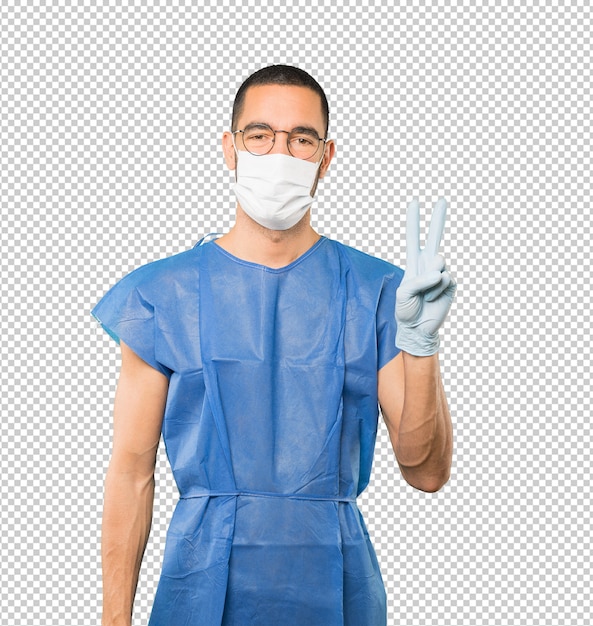 Coronavirus.Jeune homme faisant des concepts et portant un masque et des gants de protection