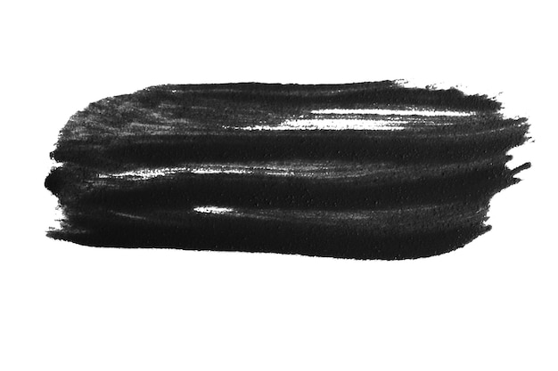 Une couche de peinture noire sur un fond blanc.