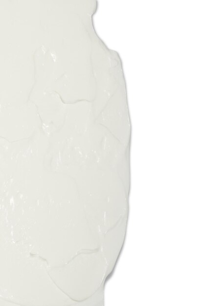 PSD crème cosmétique blanche appliquée sur un fond blanc