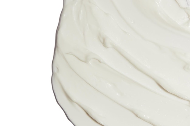 PSD crème cosmétique blanche appliquée sur un fond blanc