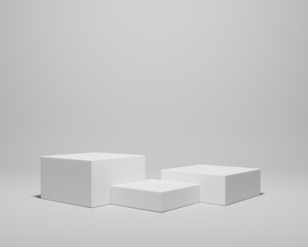 Des cubes blancs sur un fond plat pour l'affichage des produits