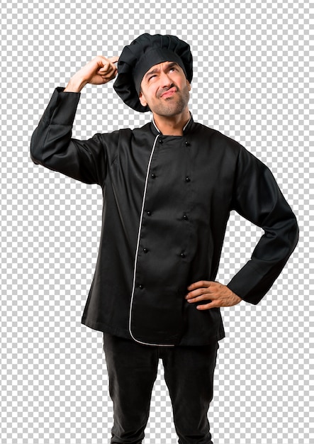 Cuoco unico in uniforme nera che ha dubbi e con l&#39;espressione faccia confusa mentre grattando la testa