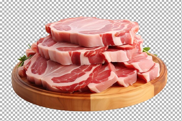 PSD un delicioso arreglo de chuletas de cerdo crudo en una tabla de cortar de madera en un fondo transparente png de superficie blanca o clara