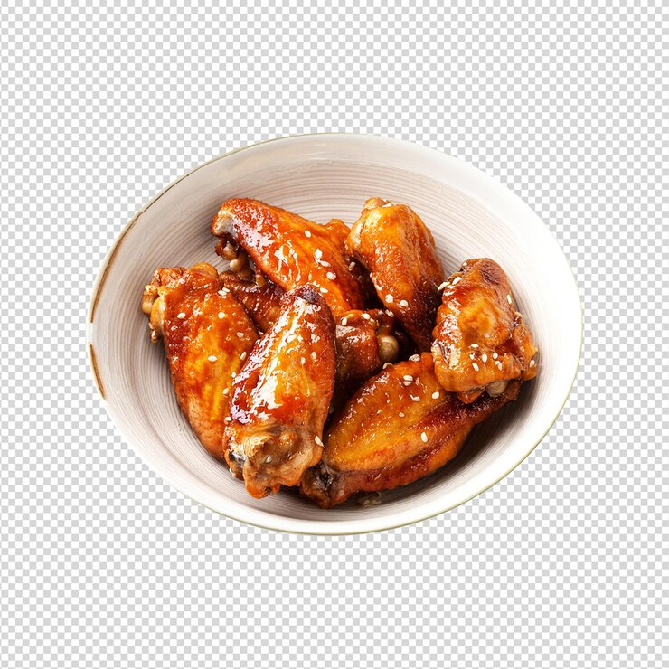 Un delicioso cuenco de alas de pollo con miel sobre un fondo transparente