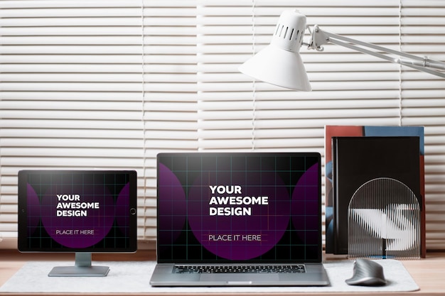 Design mockup per laptop e tablet con illuminazione da studio