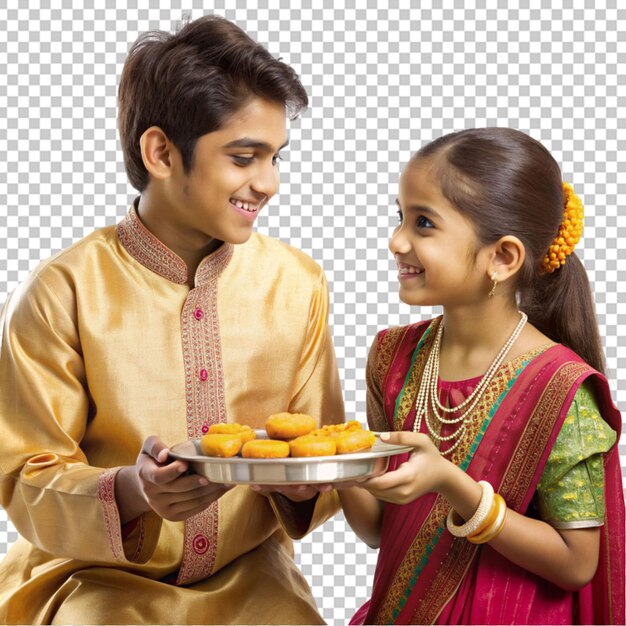 PSD deux frères et sœurs tenant une assiette de bonbons à la main pour la célébration de bhai dooj et raksha bandhan