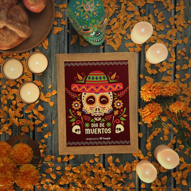 Dia de muertos rotes modell, umgeben von kerzen und blumen