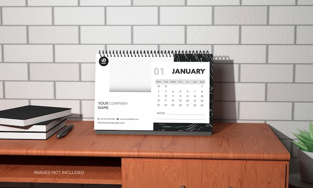 Diseño de calendario de escritorio anual 3D con pluma de libros sobre mesa sobre fondo de pared de ladrillo gris