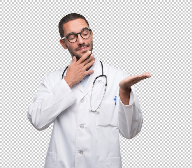 Doctor joven dudoso que muestra algo con su mano