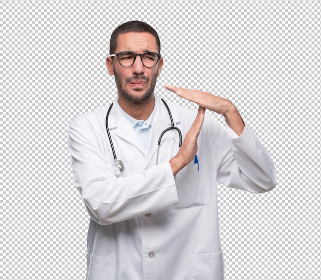 PSD doctor joven serio haciendo un gesto de descanso