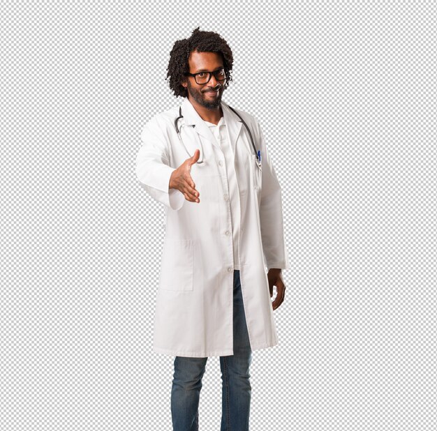 Doctor en medicina afroamericano hermoso que alcanza para saludar a alguien o que gesticula al hel