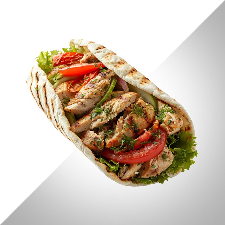PSD donner de poulet avec des légumes et des herbes dans du pain pita isolé sur un fond transparentpsd