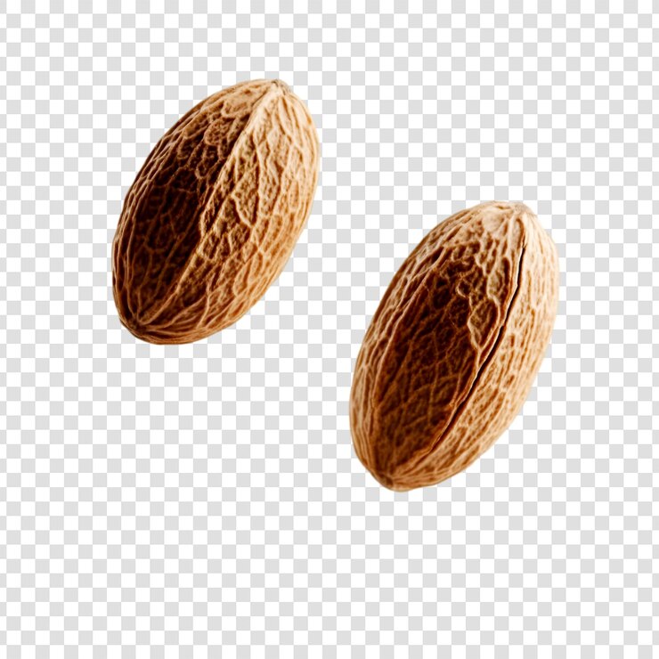 PSD dos semillas de nuez moscada flotantes aisladas de fondo especias ingrediente alimenticio