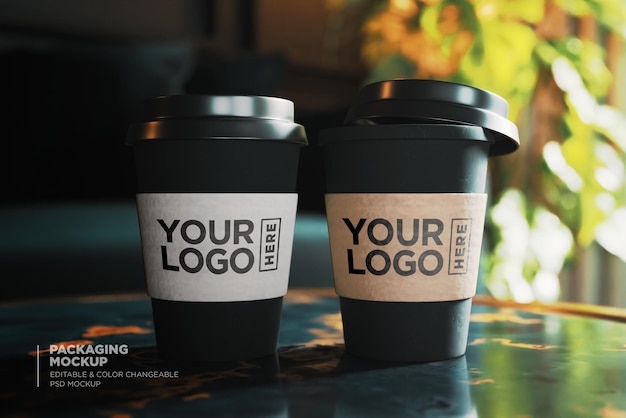 PSD dos tazas de café con las palabras de su logo en ellas