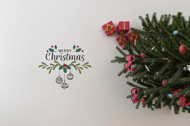 Draufsicht auf frohe weihnachten banner modell mit weihnachtsbaum und geschenken