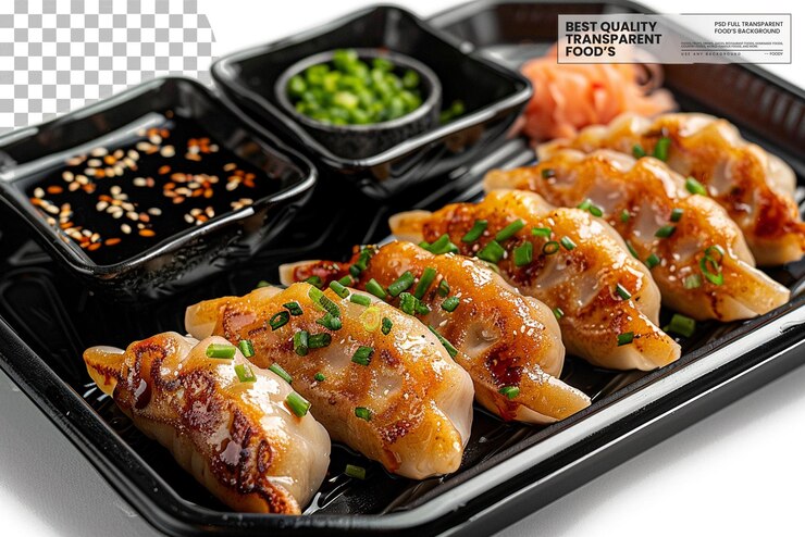 PSD dumplings rellenos variados servidos en una bandeja negra sobre un fondo transparente