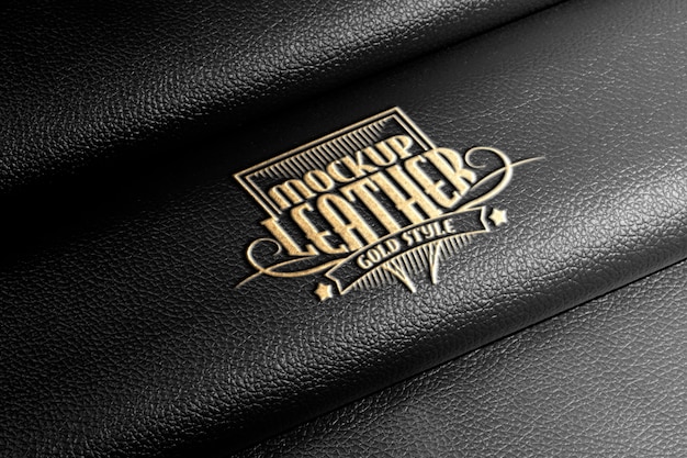 Effektgold-logo-mockup auf schwarzem leder