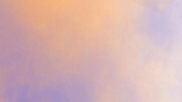 ein Bild eines lila und orangefarbenen Himmels mit einer weißen Wolke