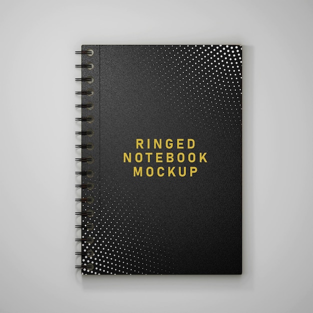 ein spiralförmiges Notebook mit einem schwarzen Cover, auf dem der Ring steht