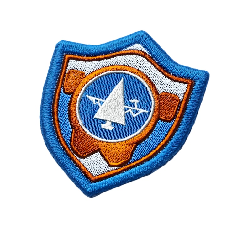 PSD embroidered patch with mountain and sun design isolated on white background
