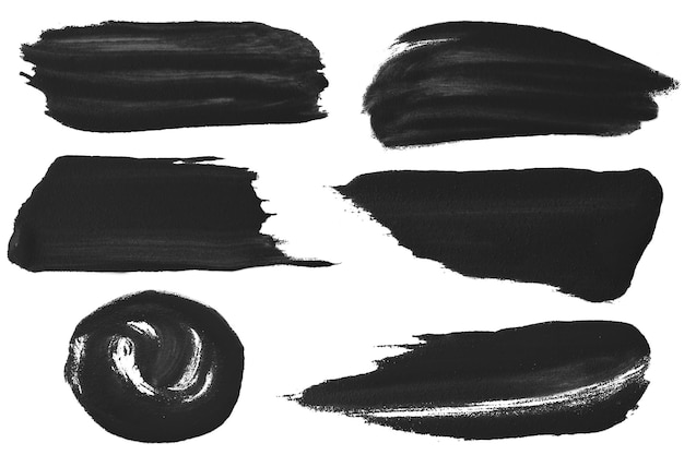 Un ensemble de traits de peinture noire sur un fond blanc
