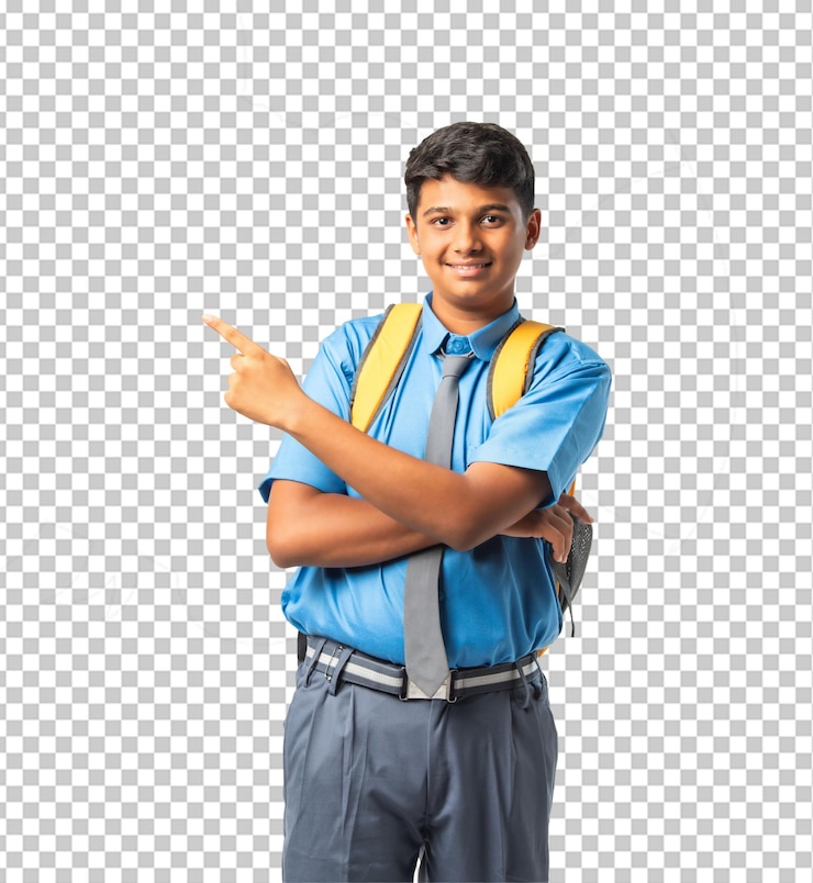 PSD un escolar indio sonriente señalando con el dedo en el uniforme escolar