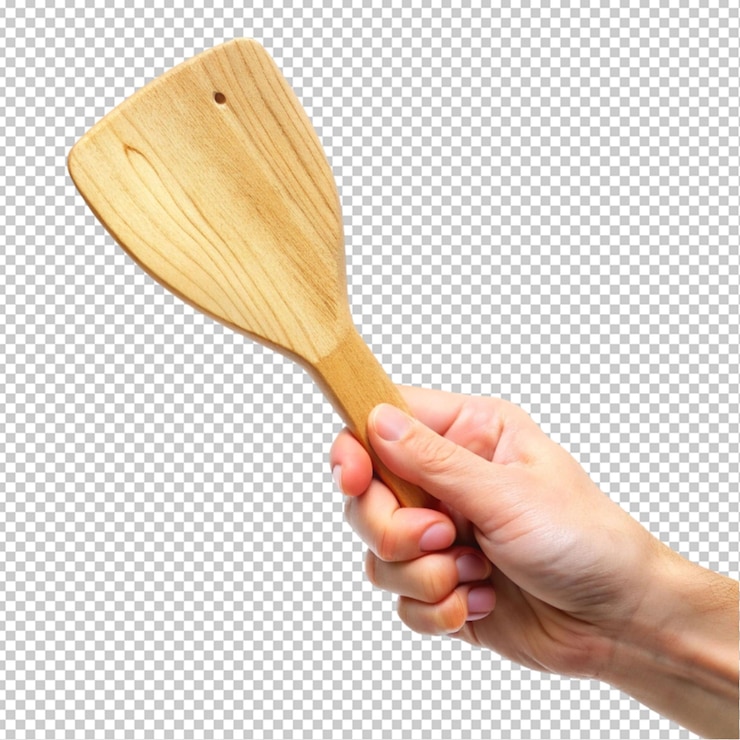 PSD espátula de cocina de madera en la mano fondo transparente