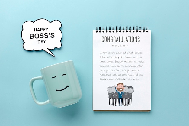 Feliz día del jefe con taza y cuaderno