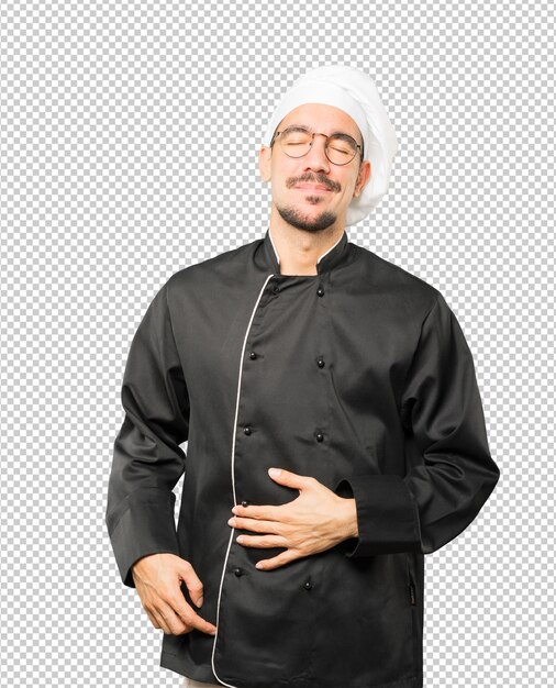 Feliz joven chef pensando en comida