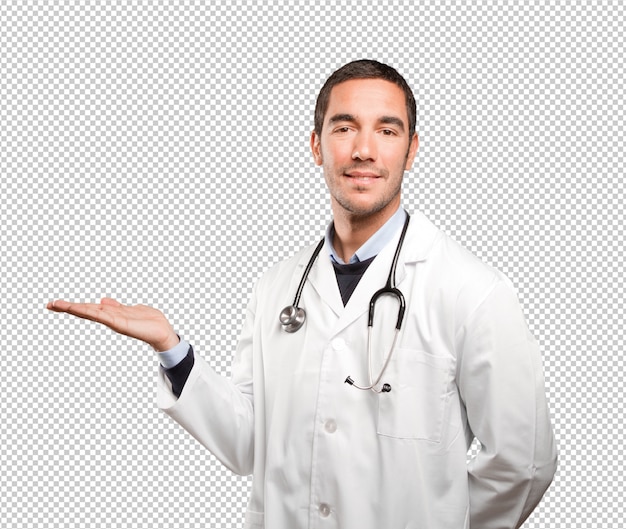 Feliz médico mostra gesto contra o fundo branco