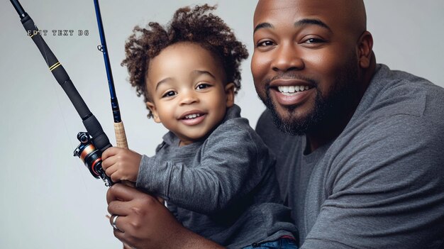 Feliz padre afroamericano y hijo pequeño con caña de pescar