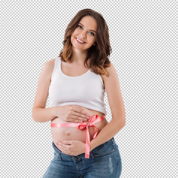 Une femme enceinte se tient isolée avec un nœud sur le ventre.