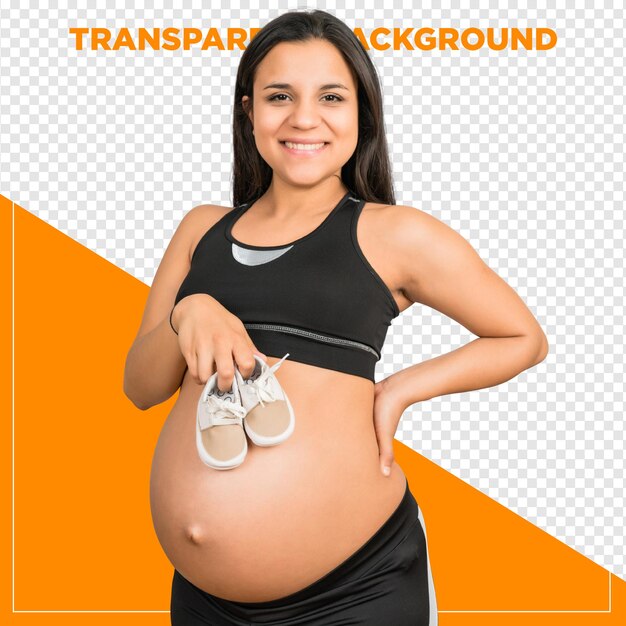 Une femme enceinte tenant des chaussures pour bébés avec un fond transparent