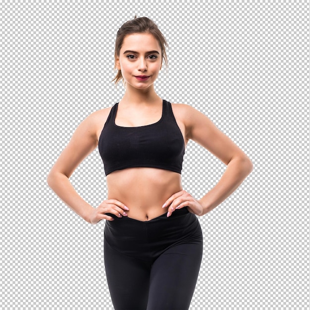 Une femme en vêtements de sport s'échauffe dans un studio isolé.