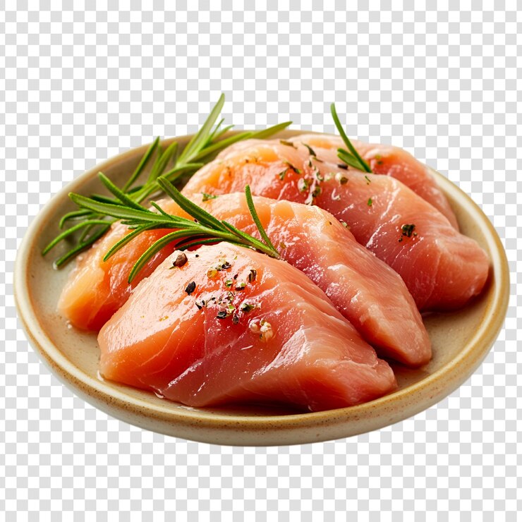 PSD filetes de pecho de pollo sazonados en un plato con guarnición de romero