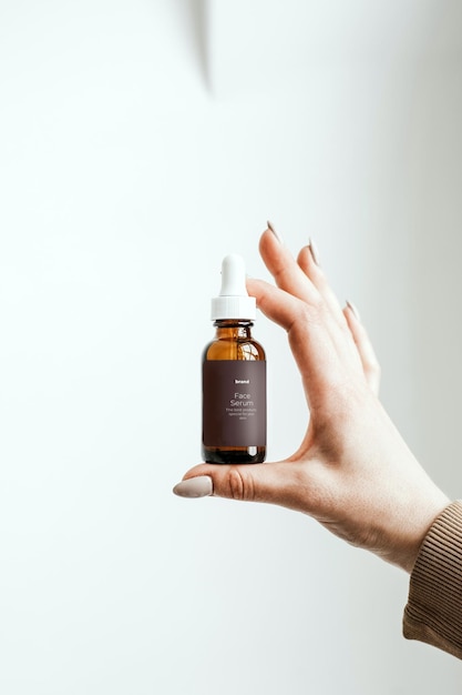 Flacone mockup per flacone cosmetico per la cura della pelle con mockup di siero mockup pipetta