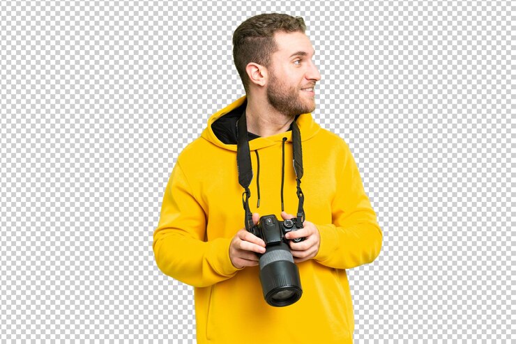 PSD fotografo giovane uomo sopra isolato chroma chiave sfondo guardando lato