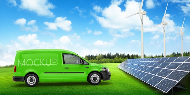 une fourgonnette verte avec le mot dessus est garée devant une turbine éolienne