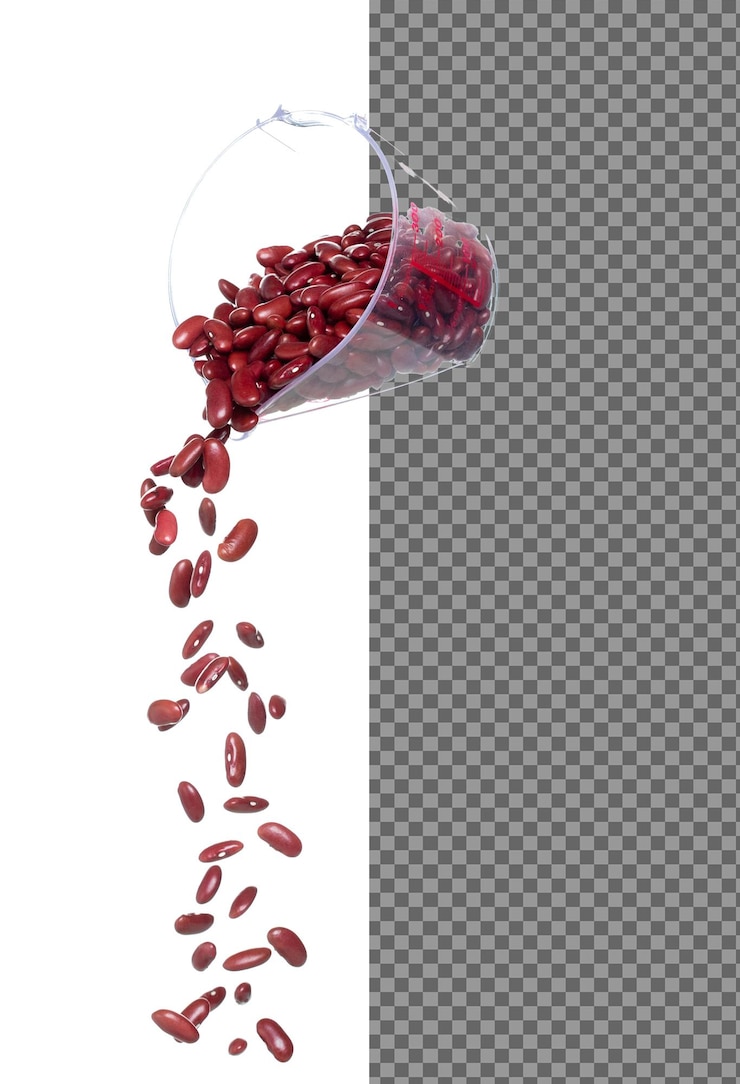 PSD el frijol rojo cae, los frijoles de grano rojo explotan, la nube abstracta vuela desde la taza de medición, el diseño de objetos de alimentos de frijol de semilla completa, el enfoque selectivo, la congelación, el fondo blanco aislado.