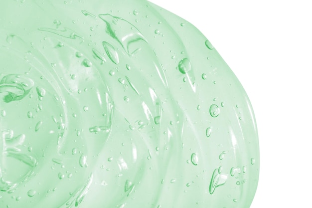 Gel verde cosmético transparente em um fundo vazio