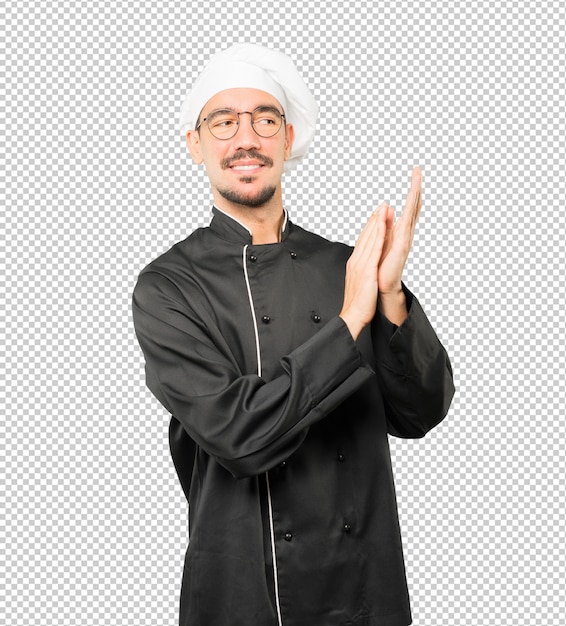 Gentil jeune chef applaudissant le geste