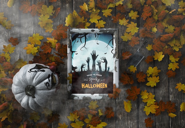 Gespenstischer Halloween-Rahmen des Draufsichttricks oder -festlichkeits mit getrockneten Blättern