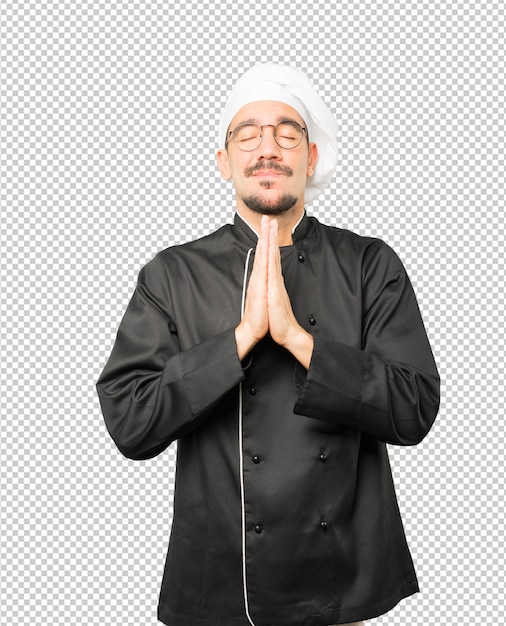 Gesto de oración feliz joven chef